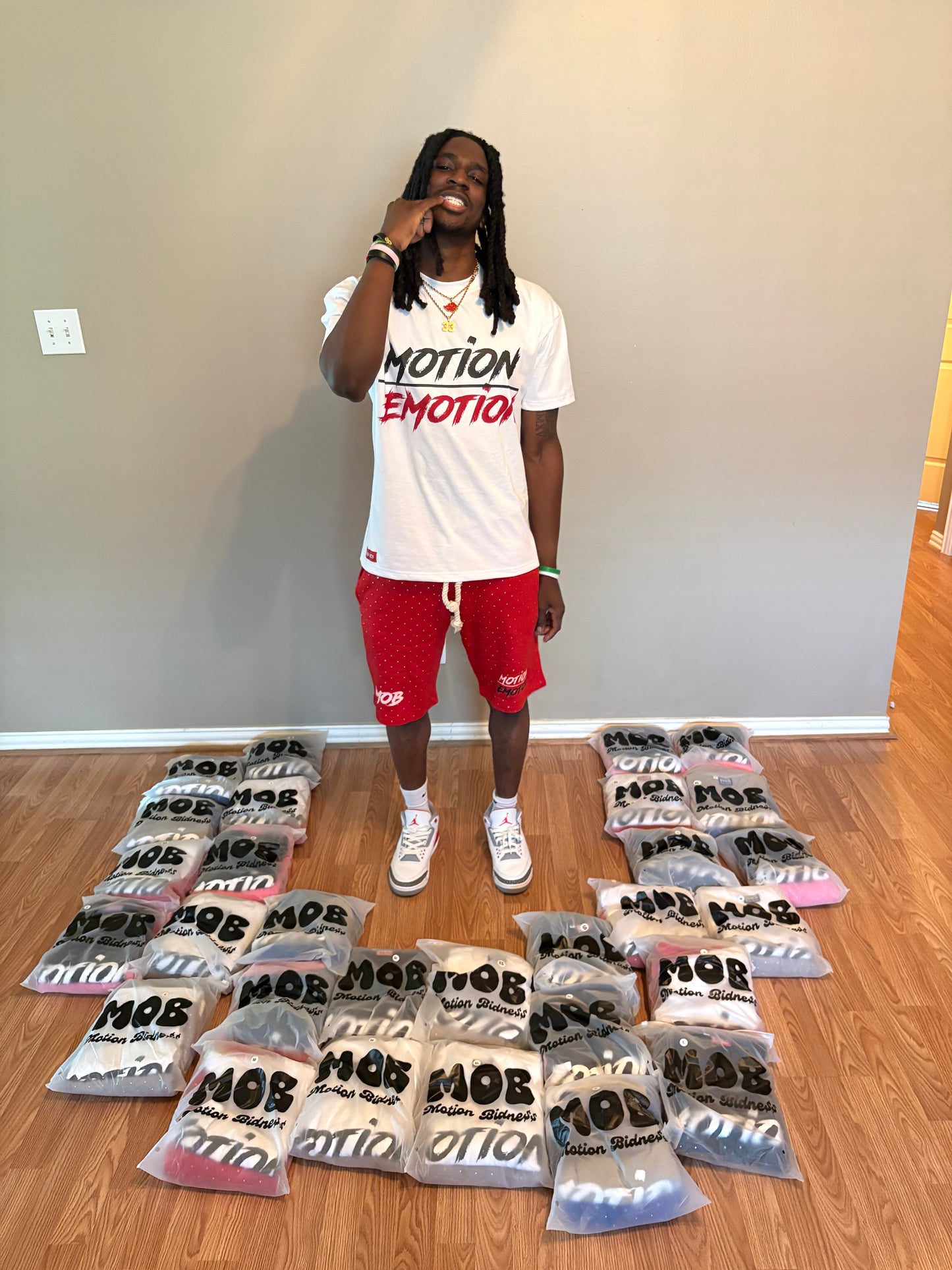MOTION OVER EMOTION RED TEES
